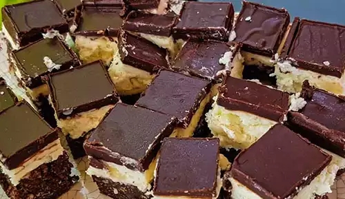 Nanaimo bars all sliced into squares for serving.