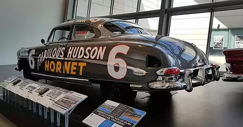 1950s Hudson car with race number 6 and text, Fabulous Hudson Hornet. 