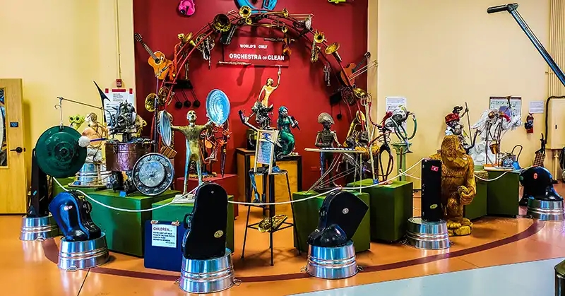 Museum of Clean display of cleaning tools assembled into an orchestra. 